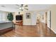 Bedroom with wood floors, large furniture, and a doorway to the hall at 928 Aspen Valley Ave, Las Vegas, NV 89123