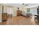 Spacious bedroom with wood floors, ceiling fan, and window at 928 Aspen Valley Ave, Las Vegas, NV 89123