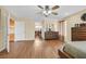 Bedroom with wood floors and furnishings, with doorway to a dining room at 928 Aspen Valley Ave, Las Vegas, NV 89123