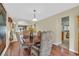 Dining room with ornate chairs leads into kitchen at 928 Aspen Valley Ave, Las Vegas, NV 89123