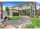 Charming two-story home with a well-manicured lawn and desert-themed landscaping at 928 Aspen Valley Ave, Las Vegas, NV 89123