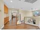 Upstairs hall featuring wood floors, built-in cabinets, and a view of the entry at 928 Aspen Valley Ave, Las Vegas, NV 89123