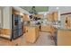 Spacious kitchen features stainless steel appliances and granite countertops at 928 Aspen Valley Ave, Las Vegas, NV 89123