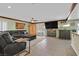 Spacious living room with a large sectional sofa, bar and tv at 928 Aspen Valley Ave, Las Vegas, NV 89123