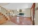 Open living room featuring hardwood floors, a fireplace, and staircase at 928 Aspen Valley Ave, Las Vegas, NV 89123
