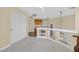 Loft with view of stairwell, carpet, and desk space near built in cabinets at 928 Aspen Valley Ave, Las Vegas, NV 89123