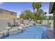 Beautiful pool with rock waterfall feature and patio seating, perfect for outdoor relaxation at 928 Aspen Valley Ave, Las Vegas, NV 89123
