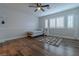 Well lit bedroom with hardwood floors and a ceiling fan at 10744 Balsam Creek Ave, Las Vegas, NV 89144