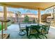 Covered patio featuring a dining table with six chairs, and an outdoor grill at 10744 Balsam Creek Ave, Las Vegas, NV 89144