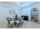 Inviting dining space with a modern table, comfortable seating, and a built-in liquor cabinet at 10744 Balsam Creek Ave, Las Vegas, NV 89144