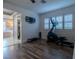 Home gym featuring an elliptical machine and hardwood floors at 10744 Balsam Creek Ave, Las Vegas, NV 89144