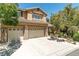 Charming two-story home featuring a three-car garage and mature landscaping, perfect for Gathering living at 10744 Balsam Creek Ave, Las Vegas, NV 89144