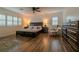 Primary bedroom featuring hardwood floors and natural lighting at 10744 Balsam Creek Ave, Las Vegas, NV 89144