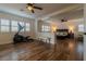 Expansive main bedroom with hardwood floors, exercise equipment, and plantation shutters at 10744 Balsam Creek Ave, Las Vegas, NV 89144