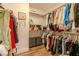 Organized walk-in closet with custom shelving and rods for ample storage space at 10744 Balsam Creek Ave, Las Vegas, NV 89144