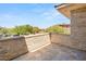 Stone balcony with stone trim overlooking the surrounding landscape at 11 Misty Peaks Ct, Las Vegas, NV 89135
