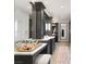 Spa-like bathroom featuring dual vanities, makeup counter, neutral color palette, and elegant lighting at 11 Misty Peaks Ct, Las Vegas, NV 89135