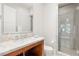A bright bathroom featuring stone countertops, tile flooring, toilet, and shower at 11 Misty Peaks Ct, Las Vegas, NV 89135