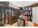 Well-organized walk-in closet with custom storage solutions, center island, and wood flooring at 11 Misty Peaks Ct, Las Vegas, NV 89135