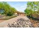 Long driveway leading to a home with mature trees and landscaping at 11 Misty Peaks Ct, Las Vegas, NV 89135