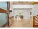 Bright foyer with gleaming floors and grand staircase leads into an open floorplan at 11 Misty Peaks Ct, Las Vegas, NV 89135