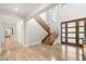 Inviting foyer with a staircase, double doors, and bright lighting at 11 Misty Peaks Ct, Las Vegas, NV 89135