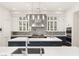 This spacious kitchen features white countertops, stainless steel appliances, and custom cabinetry at 11 Misty Peaks Ct, Las Vegas, NV 89135