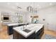 Expansive kitchen with double islands, stylish pendant lighting, and seamless flow to living area at 11 Misty Peaks Ct, Las Vegas, NV 89135