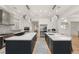 Spacious, contemporary kitchen featuring dual islands, stainless steel appliances, and modern lighting at 11 Misty Peaks Ct, Las Vegas, NV 89135