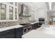 Gourmet kitchen featuring a pro-style range, custom backsplash and stainless steel appliances at 11 Misty Peaks Ct, Las Vegas, NV 89135
