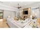Bright living room with a stone fireplace, neutral decor, and a ceiling fan at 11 Misty Peaks Ct, Las Vegas, NV 89135