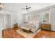 Light and airy main bedroom with hardwood floors, ceiling fan and neutral color palette at 11 Misty Peaks Ct, Las Vegas, NV 89135