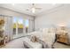 Bright main bedroom with seating, carpet, and windows overlooking the view at 11 Misty Peaks Ct, Las Vegas, NV 89135