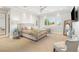 Bright main bedroom featuring carpet, light walls, and a large window for natural light at 11 Misty Peaks Ct, Las Vegas, NV 89135