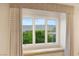 Window view of trees and the mountains in the distance at 11 Misty Peaks Ct, Las Vegas, NV 89135