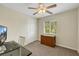 Bright bedroom offers a window view, ceiling fan and functional closet space at 1101 Elation Ln # 2, Henderson, NV 89002