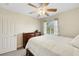 Cozy bedroom features ceiling fan, a window with natural light, and neutral tones at 1101 Elation Ln # 2, Henderson, NV 89002