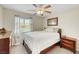 Bedroom featuring ceiling fan, a window with natural light, and neutral tones at 1101 Elation Ln # 2, Henderson, NV 89002