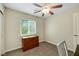 This bedroom boasts a ceiling fan, window view, and closet at 1101 Elation Ln # 2, Henderson, NV 89002
