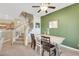 Charming dining area with decorative deer statues, a wooden table and stair access to the second floor at 1101 Elation Ln # 2, Henderson, NV 89002