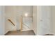 Bright hallway with stairs and white railing at 1101 Elation Ln # 2, Henderson, NV 89002