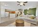 Open living space with a seamless flow into the kitchen, featuring comfortable seating and modern design at 1101 Elation Ln # 2, Henderson, NV 89002