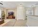 Inviting living room with neutral tones, tile and carpet flooring, and lots of natural light at 1101 Elation Ln # 2, Henderson, NV 89002