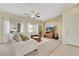 Comfortable living area featuring a plush sofa, large windows, and stylish decor at 1101 Elation Ln # 2, Henderson, NV 89002