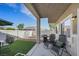 Relaxing covered patio area features comfortable seating and barbecue grill at 1101 Elation Ln # 2, Henderson, NV 89002