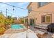 Inviting backyard with pool, patio seating, and landscaping, offering a private outdoor retreat at 11226 Kenyan Sunshine Ct, Las Vegas, NV 89138