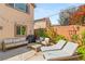 Cozy backyard patio with seating, landscaping, and string lights, perfect for outdoor entertaining at 11226 Kenyan Sunshine Ct, Las Vegas, NV 89138