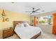 Cozy primary bedroom featuring a ceiling fan, comfortable bed, and windows with natural light at 11226 Kenyan Sunshine Ct, Las Vegas, NV 89138