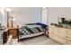Cozy bedroom featuring wood floors, a single bed, and natural light at 1128 Galangate Ave, Henderson, NV 89015