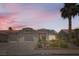 Charming single-story home featuring desert landscaping, a two-car garage, and a classic tile roof at 1128 Galangate Ave, Henderson, NV 89015
